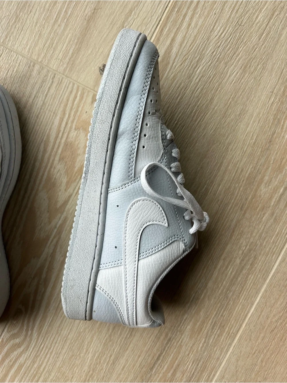 Nike White Low-Top Leather Sneakers with Subtle Gray Accents